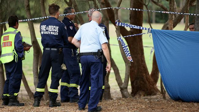 Firefighters arrive to erect a tarp over the crime scene at Buffalo Creek Reserve Playground in Hunters Hill last Wednesday. Picture: Jonathan Ng