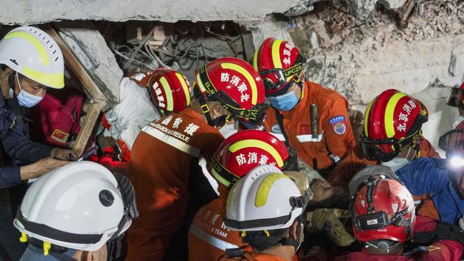 Rescuers move a survivor out from a collapsed building in the aftermath of an earthquake in Mandalay, Myanmar. Picture: Xinhua via AP