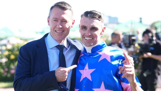 Part-owner Craig McRae (left) and jockey Billy Egan celebrate Feroce’s Australian Guineas victory at Flemington. Picture: Scott Barbour / Racing Photos