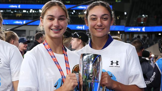 SYDNEY, AUSTRALIA - APRIL 30: Indiana Dos Santos and Jynaya Dos Santos of Sydney FC pose with the trophy as they celebrate victory during the A-League Women's Grand Final match between Western United and Sydney FC at CommBank Stadium on April 30, 2023, in Sydney, Australia. (Photo by Mark Kolbe/Getty Images)