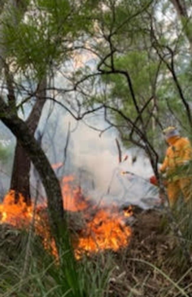 A firefighter putting out a blaze at Springbrook on the weekend.