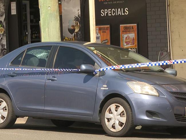 Police have cordoned off this car as they carry out investigations in Railway Parade, Glenfield. Picture: TNV