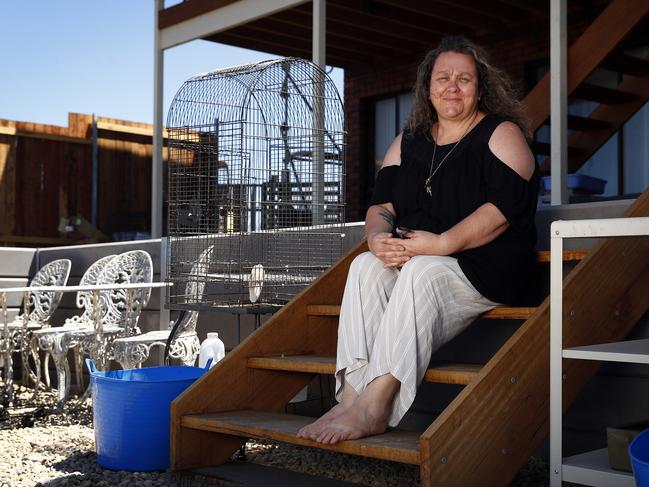 Kim Harper pictured in front of her house which survived the fires with minimal garden and deck damage. Picture: Sam Ruttyn