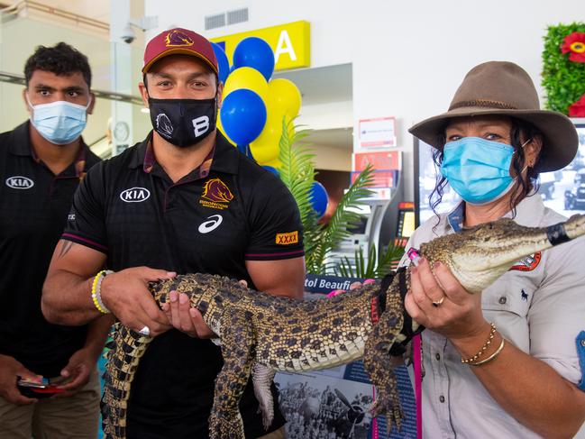 Brisbane Broncos Alex Glenn with a croc in Darwin. Picture: Che Chorley