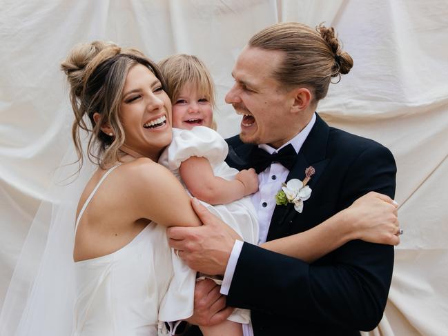 Woody Whitelaw and Mim Gibbs with their daughter Remi. Picture: Mimo Weddings