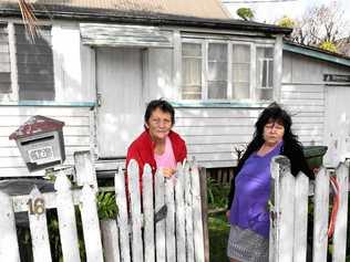 FLOOD DAMAGE: Cheryl Jones and Jackie Jensen need some community assistance in repairing their fence, which was damaged in the 2013 floods. Picture: Mike Knott BUN060718FENCE2