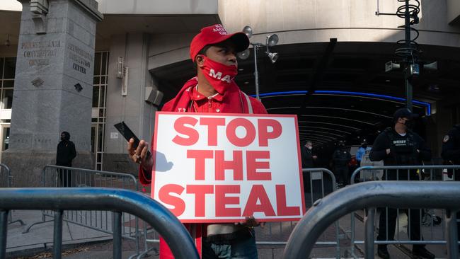 A Trump supporter protests outside the Pennsylvania Convention Centre in Philadelphia, one of the most watched mail-in ballot counting locations. Picture: AFP