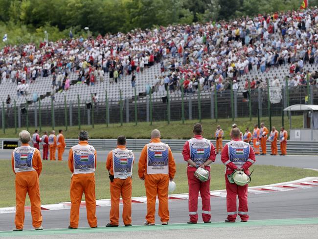 Track marshals, crowd observe minute’s silence for Bianchi.