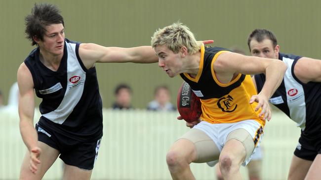 A young Jeremy Howe (right) in action for Hobart.