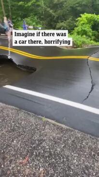 Residents capture the moment a road buckles and collapses