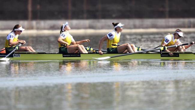 Australia’s Women’s Four, Olympia Aldersey, Katrina Werry, Sarah Hawe and Lucy Stephan, after winning gold at the World Rowing Championships in Austria. Picture: AP PHOTO/MATTHIAS SCHRADER