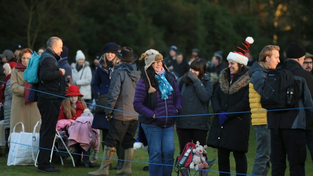 Members of the general public queue up to view the arrival of royals this morning. Picture: Associated Press