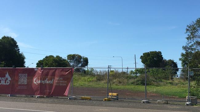 The Queensland Government banner adorned the fencing during the state election campaign but the only sign of work at the fire station site was a fresh mow.