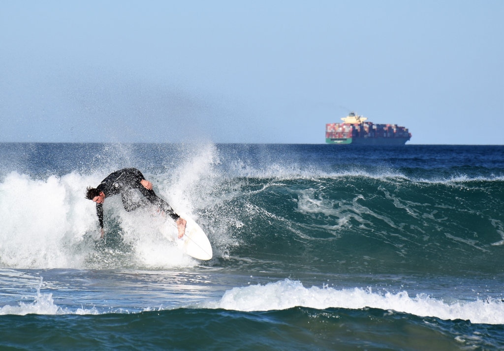 Surfers and bodyboard riders making the most of the waves at Kawana on the weekend. Picture: Mark Furler