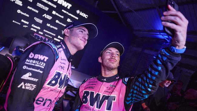 Doohan (L) and Gasly pose for a photo with the team's new A525 Formula One racing car during the BWT Alpine F1 Team's 2025 season launch, in London. Picture: Benjamin Cremel/AFP