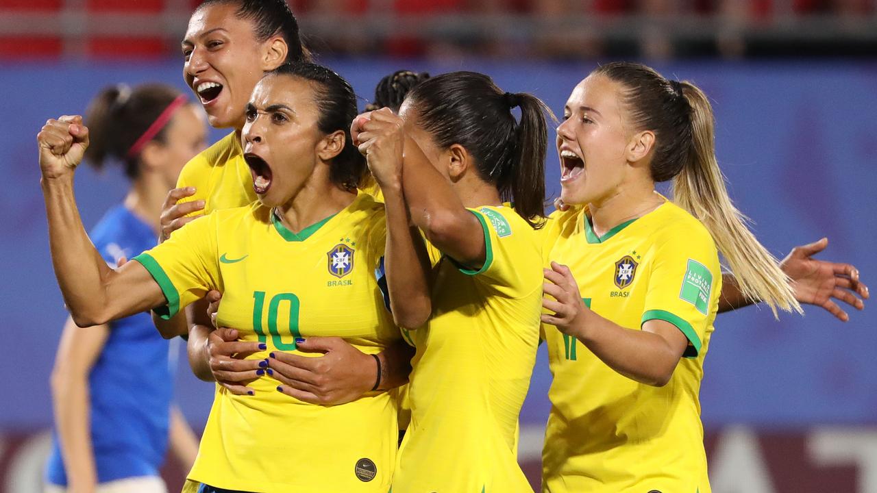VALENCIENNES, FRANCE – JUNE 18: Marta of Brazil celebrates with teammates after scoring her team's first goal during the 2019 FIFA Women's World Cup France group C match between Italy and Brazil at Stade du Hainaut on June 18, 2019 in Valenciennes, France. (Photo by Robert Cianflone/Getty Images)