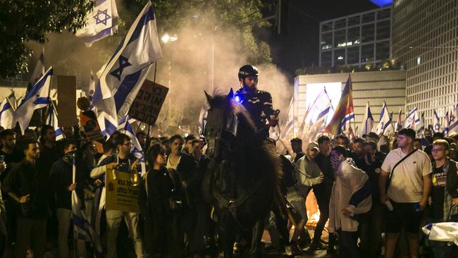 Israeli protesters clash with a mounted police officer during a demonstration against the Israeli government's judicial overhaul. Picture: Getty Images.