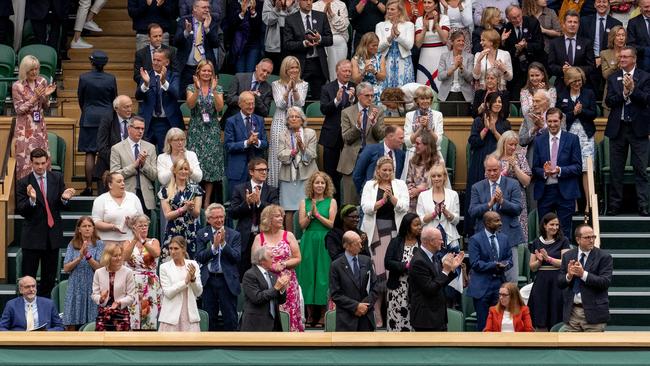 The Wimbledon crowd gives a standing ovation to the University of Oxford Professor Sarah Gilbert (seated in red, bottom right) one of the people behind the Astra Zeneca vaccine. Picture: Getty Images