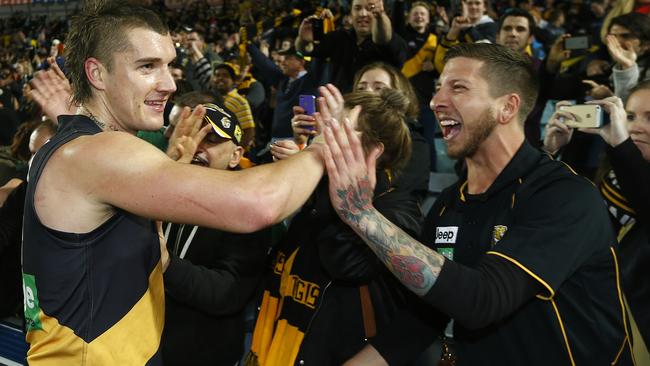 Martin celebrates with the fans after Richmond’s big win over Sydney. Picture: Wayne Ludbey