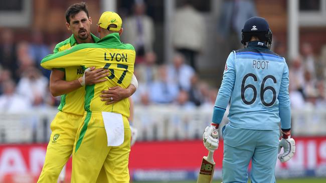 Mitchell Starc celebrates with Nathan Lyon after dismissing Joe Root at Lord’s during their Cricket World Cup group stage match. Picture: Getty Images