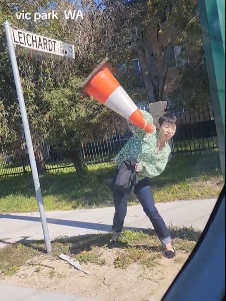 The woman threw a traffic cone at the car in front of her. Picture: TikTok