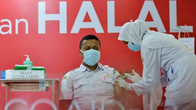 A health worker administers the Sinovac vaccine at Zainoel Abidin Hospital in Banda Aceh. Picture: AFP