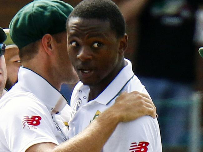 FILE -- In this March 9, 2018 file photo South Africa's bowler Kagiso Rabada, second right, celebrates a wicket with team mates during the second cricket test match between South Africa and Australia at St George's Park in Port Elizabeth, South Africa, Rabada has been banned for the rest of the series against Australia after being found guilty of two charges of misconduct for aggressive wicket celebrations. (AP Photo/Michael Sheehan, File)