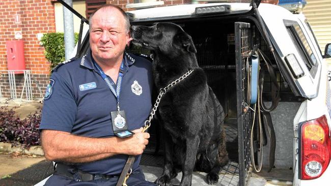 COMMUNITY HERO: Dog handler Sergeant Bill Applebee with Angel. Picture: Mike Knott BUN060718BILL4