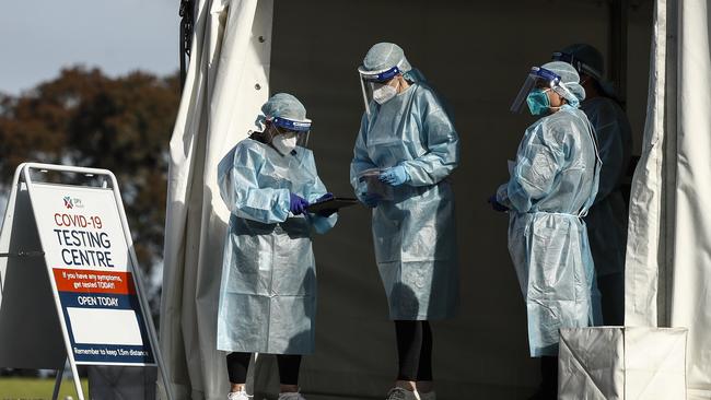 Health workers in full PPE at a pop-up COVID-19 test site in Clyde, Melbourne. Picture: NCA NewsWire / Daniel Pockett