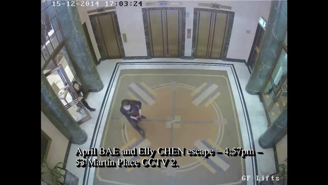 Moment of escape: Two hostages run out at 4:57pm.