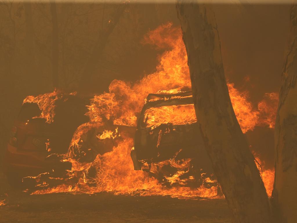 House is protected at Bruxton. Bushfire surrounds the town of Buxton in the Southern Highlands as Rural Fire Service work to protect as many homes as they can. Picture: Rohan Kelly