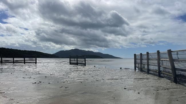 A weather event in January 2024 damaged the swimming enclosure at Dingo Beach in the Whitsundays with the council then removing pylons and mesh. Picture: Julie Houston