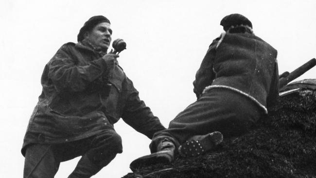 War correspondent Chester Wilmot broadcasts from an observation post on the roof of a home in The Netherlands in 1944. Picture: Getty Images