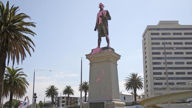 A vandalised statue of Captain Cook in St Kilda, Melbourne, covered in pink paint. Picture: Stuart McEvoy.