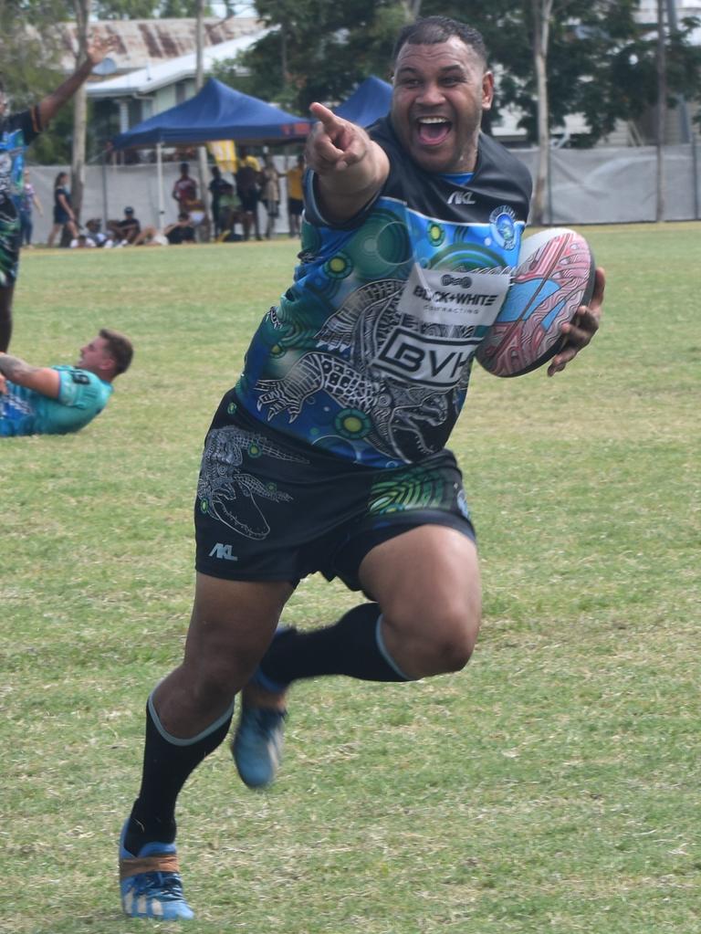 Javarn White celebrates as he prepares to go in for a try for Tunuba Dakani in the men's grand final at the Warba Wangarunya Rugby League Carnival.