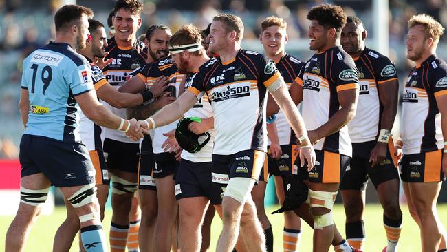 CANBERRA, AUSTRALIA - MARCH 15: Waratahs and Brumbies players shale hands after the round seven Super Rugby match between the Brumbies and the Waratahs at GIO Stadium on March 15, 2020 in Canberra, Australia. (Photo by Mark Metcalfe/Getty Images)