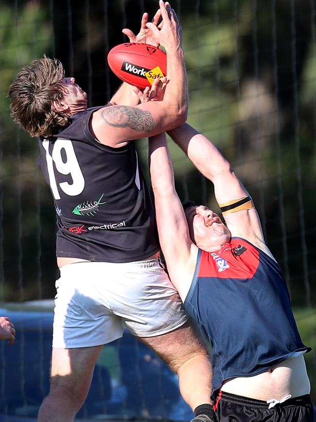 Omeo-Benambra’s James Gibbs flies for a mark. Picture: Yuri Kouzmin