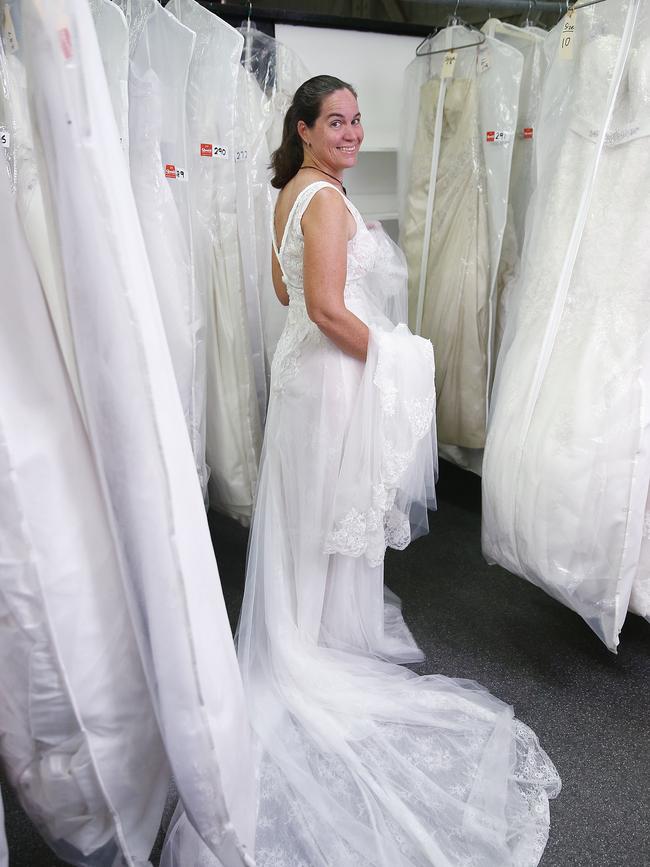 Bride-to-be Michelle Arthur tries on dozens of wedding dresses at Quaid Auctioneers ahead of her big day later this year. Picture: Brendan Radke