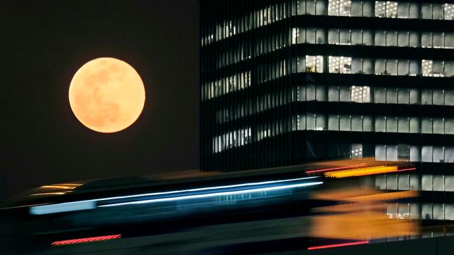 A large, full moon, known as a ‘Supermoon’, will set for the last time in Australia for the year. Picture: Kazuhiro Nogi / AFP