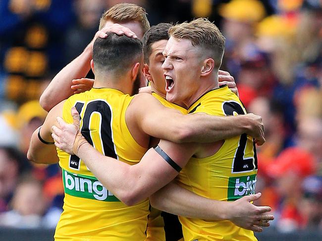 Richmond’s Josh Caddy (right) celebrates a goal in the 2017 AFL grand final. Picture: Mark Stewart