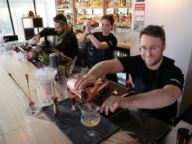 Head bar tender Diego Ottolini, Stephanie Deller and Alex Van De Mortel shaking up some cocktails at Alex &amp; Co/ Pic: AAP Image/Carmela Roche