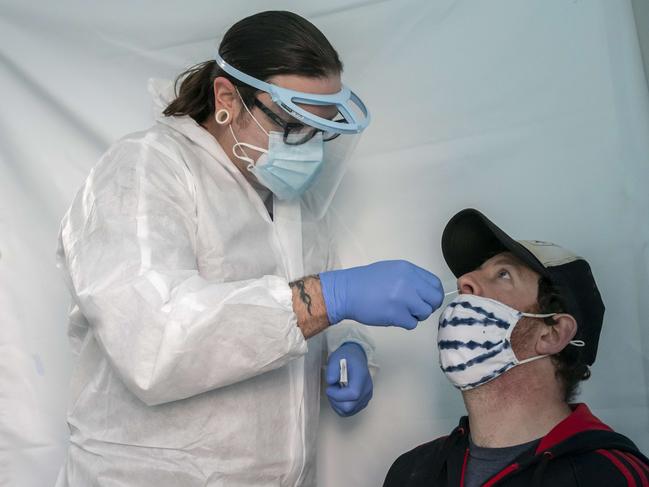 A man is tested for COVID-19 after his flight landed in Portland in the US. Picture: Getty Images/AFP