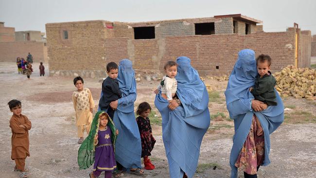 Members of an internally displaced Afghan family who left their home during the ongoing conflict between Taliban and Afghan security forces arrive from Qala-i- Naw, in Enjil district of Herat, on July 8. Picture: AFP