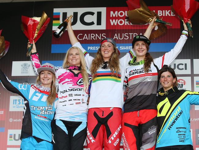 Action from the second round of the 2016 UCI Mountain Bike World Cup championship, held at Smithfield Mountain Bike Park, Cairns. PICTURE: BRENDAN RADKE. Womens downhill final top five (L-R) Tahnee Seagrave, Tracey Hannah, winner Rachel Atherton, Manon Carpenter and Morgane Charre on the race podium. PICTURE: BRENDAN RADKE