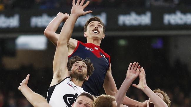 MELBOURNE, AUSTRALIA - MAY 16: Jake Lever of the Demons, Levi Casboult of the Blues, Steven May of the Demons, Harrison Petty of the Demons and Harry McKay of the Blues compete for the ball during the 2021 AFL Round 09 match between the Melbourne Demons and the Carlton Blues at the Melbourne Cricket Ground on May 16, 2021 in Melbourne, Australia. (Photo by Dylan Burns/AFL Photos via Getty Images)