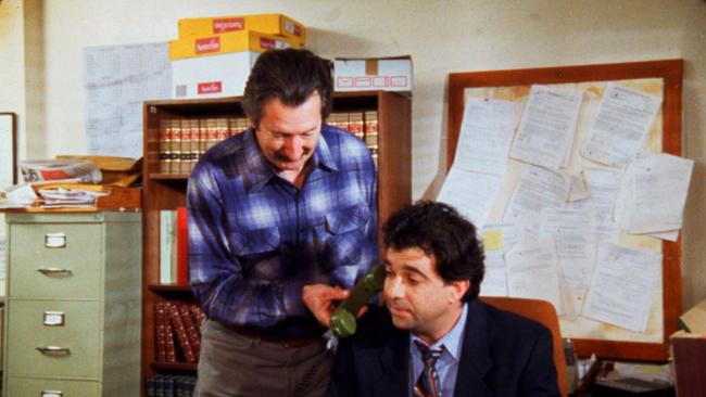 The vibe of the thing: Darryl Kerrigan (Michael Caton) briefs lawyer Dennis Denuto (Tirel Mora) in the movie The Castle. Picture: Supplied