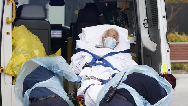 An elderly Epping Gardens resident is wheeled out by Paramedics to be transported by ambulance. Picture: David Caird