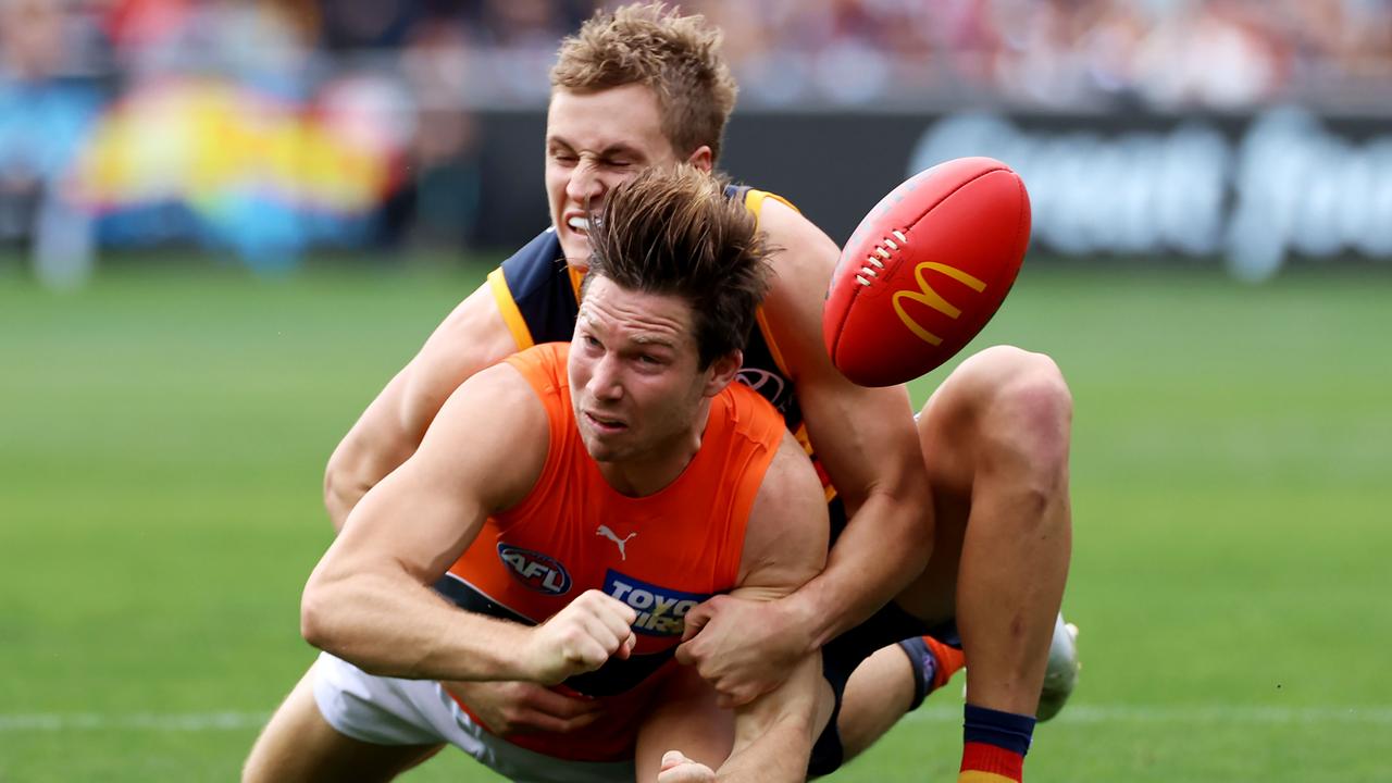 Jordan Dawson tackles the star of the show Toby Greene. Picture: James Elsby/AFL Photos