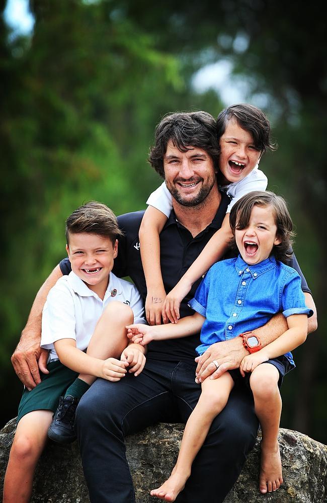 Nathan Hindmarsh with his boys Archie, Buster and Rowdie.