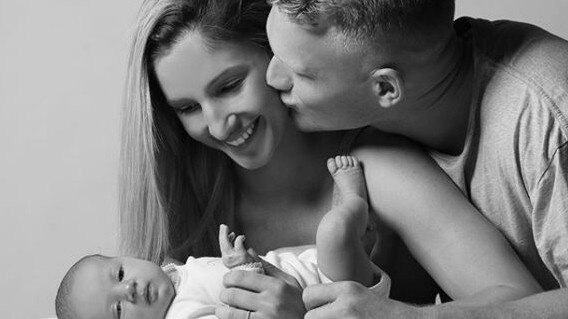 Adam Treloar with fiancee Kim and daughter Georgie. Source: Instagram